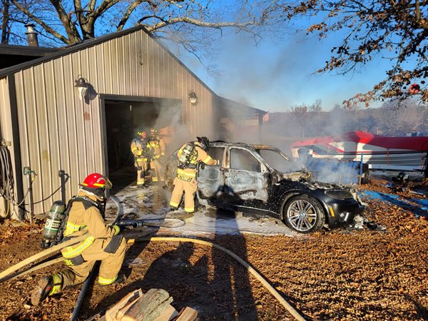Vehicle fire threatens garage near Lovelaceville