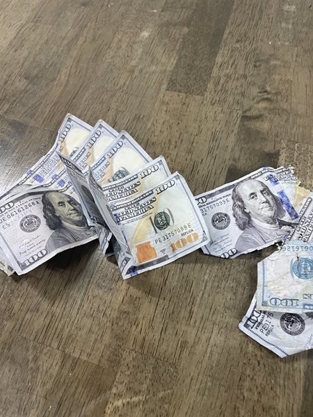 Graves County road crew discovers fake $100 bills in ditches