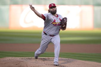 Lynn gets first win in second stint with Cardinals, a 3-2 victory at Oakland