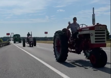 Two dozen antique tractors drive across LBL