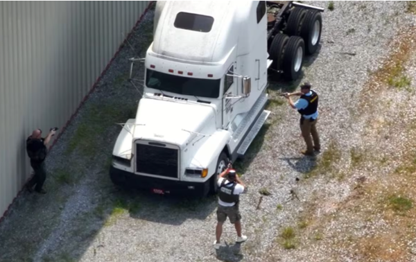 Cunningham man charged with making threatening posts on social media