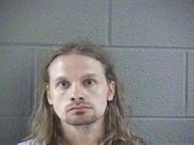 Warrant service turns into drug arrest for Murray man