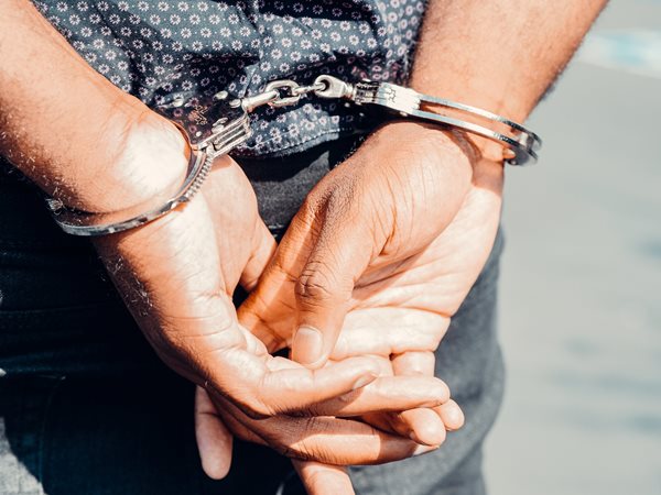 Metropolis men accused of throwing brick at a vehicle
