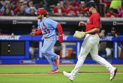 Donovan scores on passed ball in 10th, Cards beat Guardians 2-1