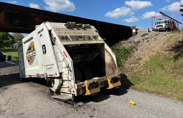 Garbage truck hits railroad bridge in Graves County